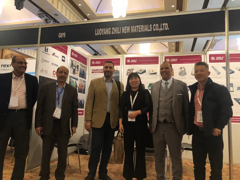 ZL team meeting international visitors at a wear-parts exhibition booth